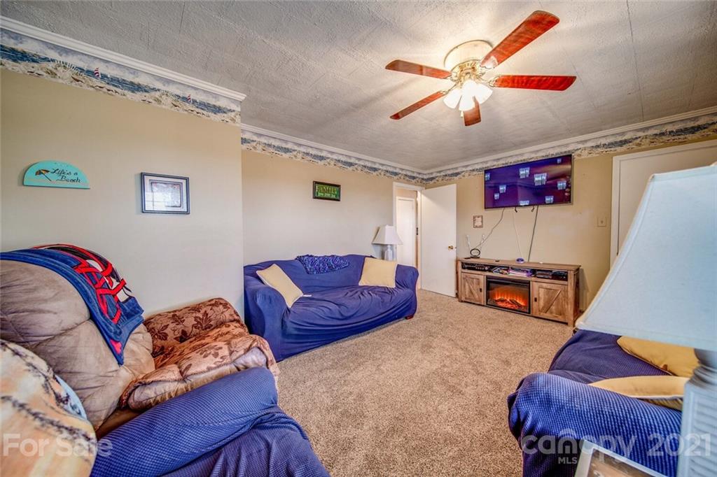 1260 Goodnight Road Salisbury, NC 28147 - Photo 7 of 13 a living room with furniture and a flat screen tv