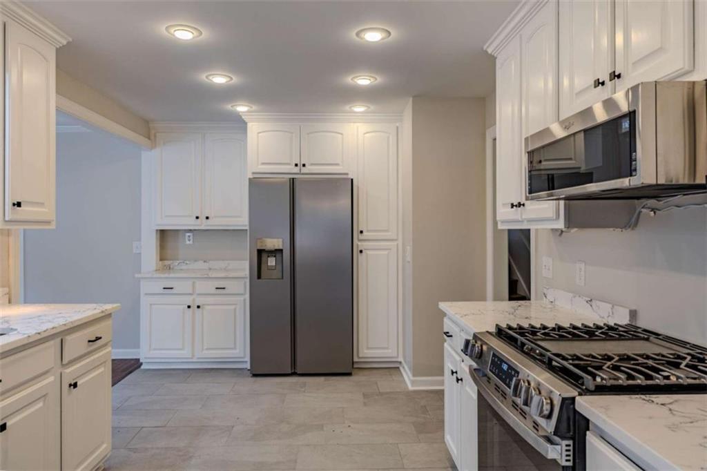 30 Polaris Terrace Northwest Rome, GA 30165 - Photo 12 of 44 a kitchen with a stove microwave and refrigerator