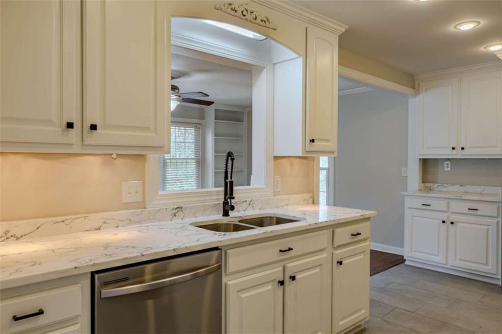 30 Polaris Terrace Northwest Rome, GA 30165 - Photo 13 of 44 a kitchen with granite countertop a sink and cabinets