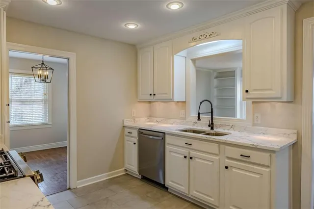 a view of a sink and cabinets
