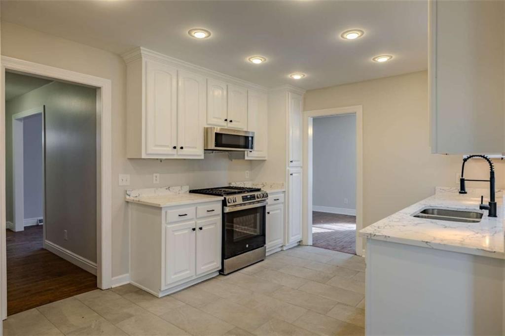 30 Polaris Terrace Northwest Rome, GA 30165 - Photo 15 of 44 a kitchen with stainless steel appliances granite countertop a sink and a stove top oven
