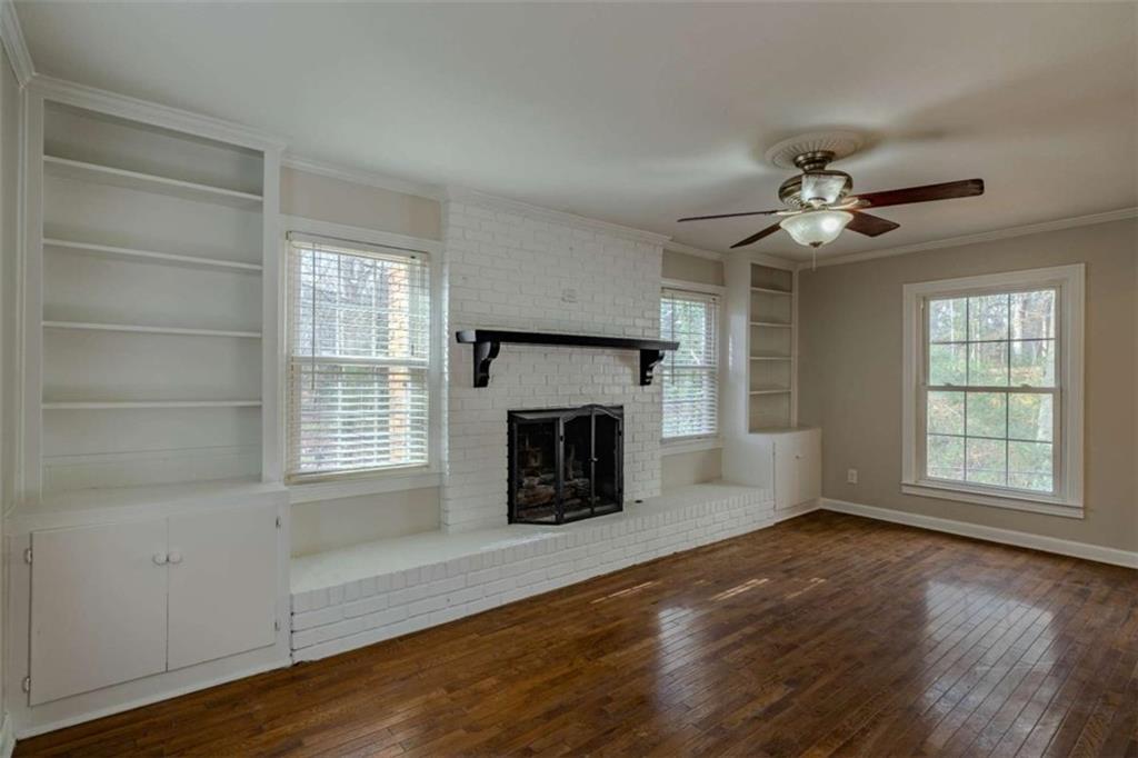 30 Polaris Terrace Northwest Rome, GA 30165 - Photo 16 of 44 an empty room with windows and fireplace
