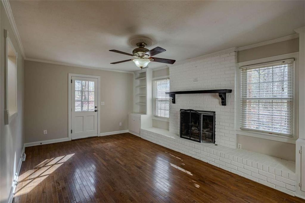 30 Polaris Terrace Northwest Rome, GA 30165 - Photo 17 of 44 a view of an empty room with wooden floor fireplace and a window
