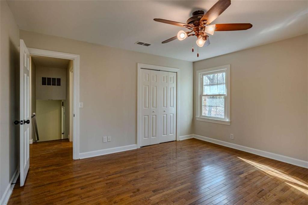 30 Polaris Terrace Northwest Rome, GA 30165 - Photo 22 of 44 a view of an empty room with window and wooden floor