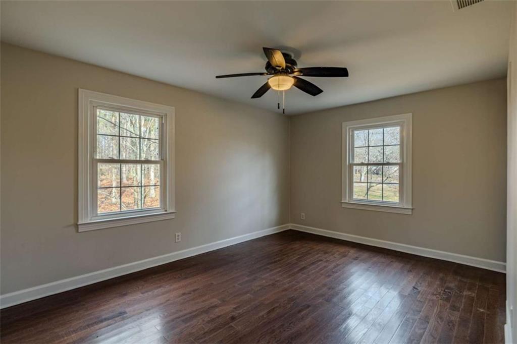 30 Polaris Terrace Northwest Rome, GA 30165 - Photo 23 of 44 a view of an empty room with wooden floor and a window
