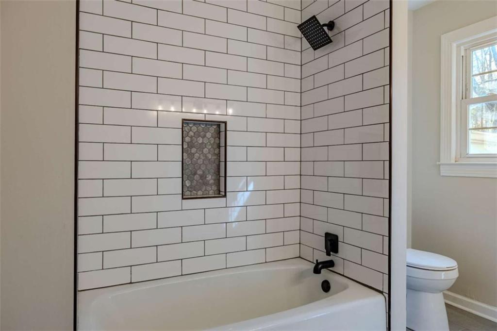 30 Polaris Terrace Northwest Rome, GA 30165 - Photo 28 of 44 a bathroom with a bathtub and toilet