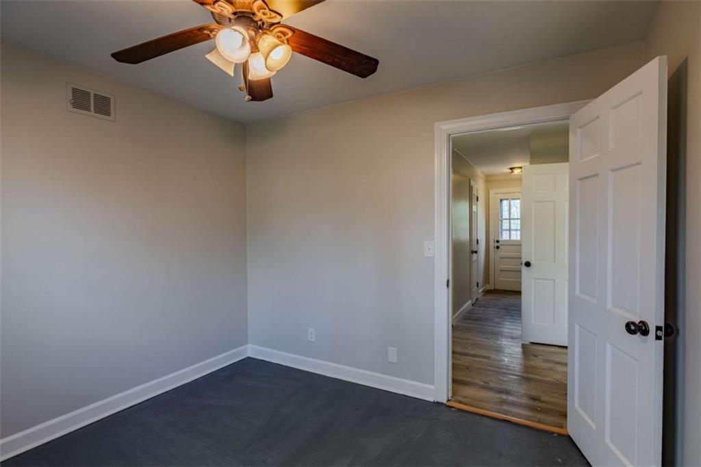 30 Polaris Terrace Northwest Rome, GA 30165 - Photo 31 of 44 an empty room and chandelier fan in hallway