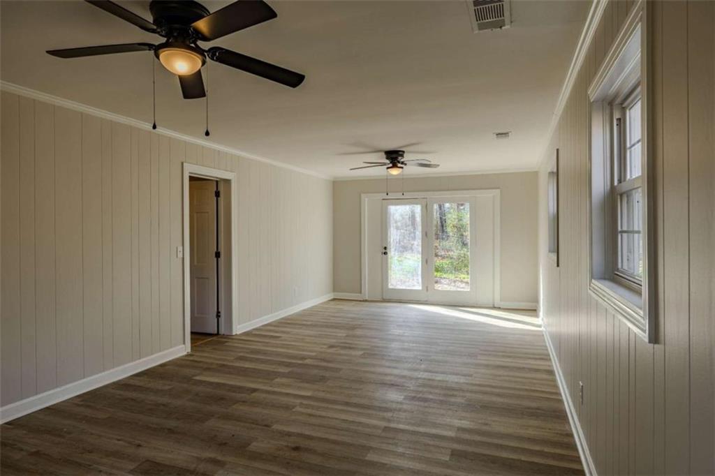 30 Polaris Terrace Northwest Rome, GA 30165 - Photo 36 of 44 a view of an empty room with window and wooden floor