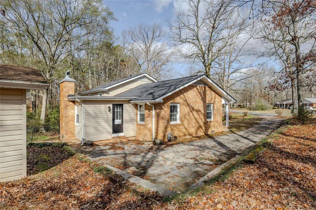 30 Polaris Terrace Northwest Rome, GA 30165 - Photo 38 of 44 a front view of a house with a yard and large tree