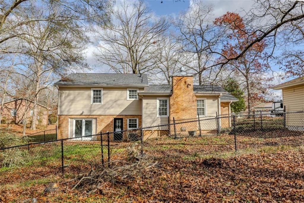 30 Polaris Terrace Northwest Rome, GA 30165 - Photo 40 of 44 a view of a white house that has a small yard and large trees