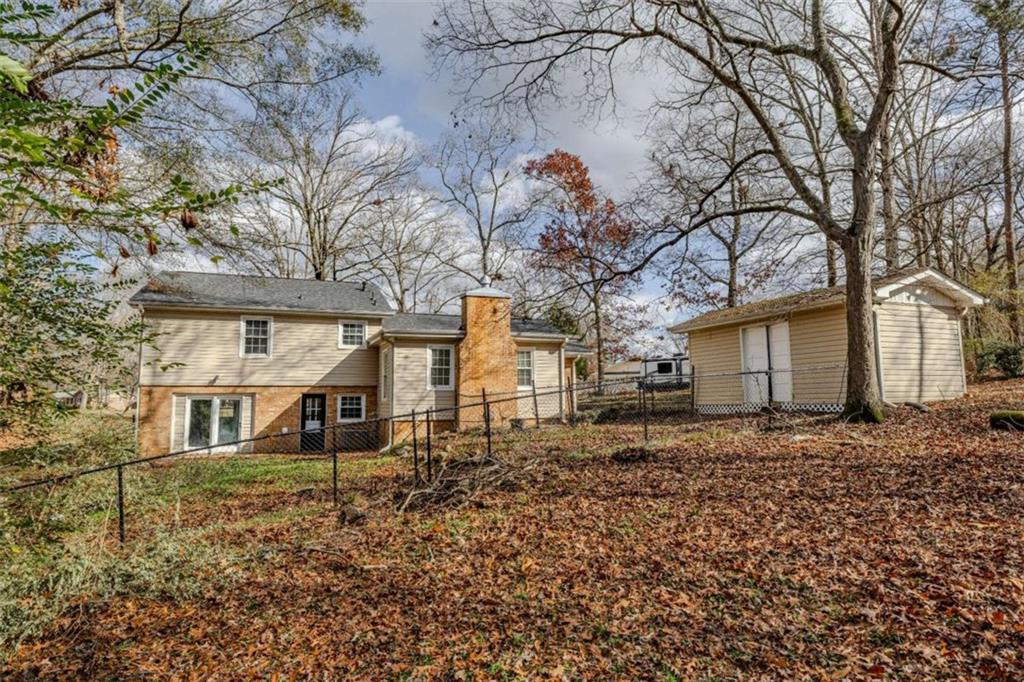 30 Polaris Terrace Northwest Rome, GA 30165 - Photo 41 of 44 a backyard of a house with wooden fence and large trees