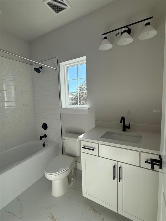 4717 West Laurel Road Tampa, FL 33629 - Photo 11 of 18 a bathroom with a sink a toilet and shower
