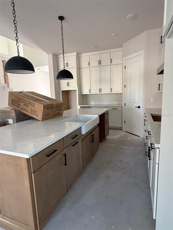 4717 West Laurel Road Tampa, FL 33629 - Photo 6 of 18 a kitchen with stainless steel appliances a stove a sink and a wooden floor