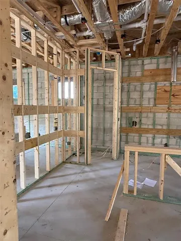 a view of an empty room with a fireplace