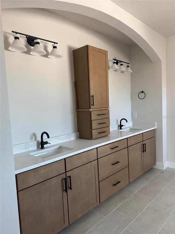 4717 West Laurel Road Tampa, FL 33629 - Photo 9 of 18 a bathroom with a double vanity sink and mirror