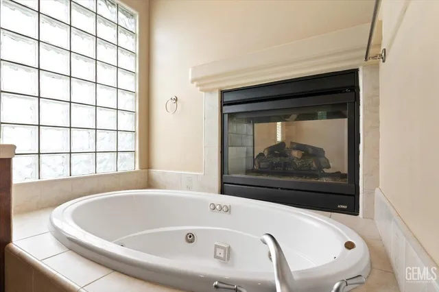a kitchen with stainless steel appliances granite countertop a sink dishwasher stove and cabinets