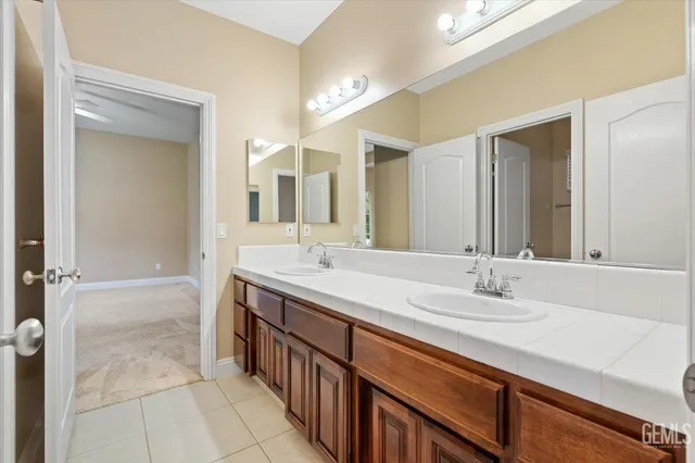 a view of a backyard with chair and potted plants