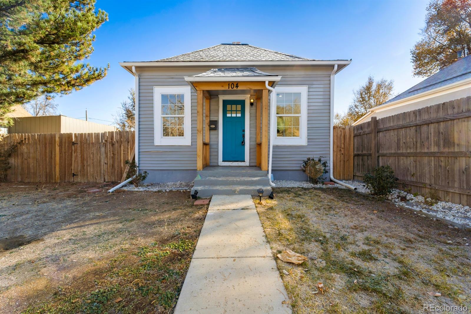 104 Stuart Street Denver, CO 80219 - Photo 1 of 18 a view of a house with a yard