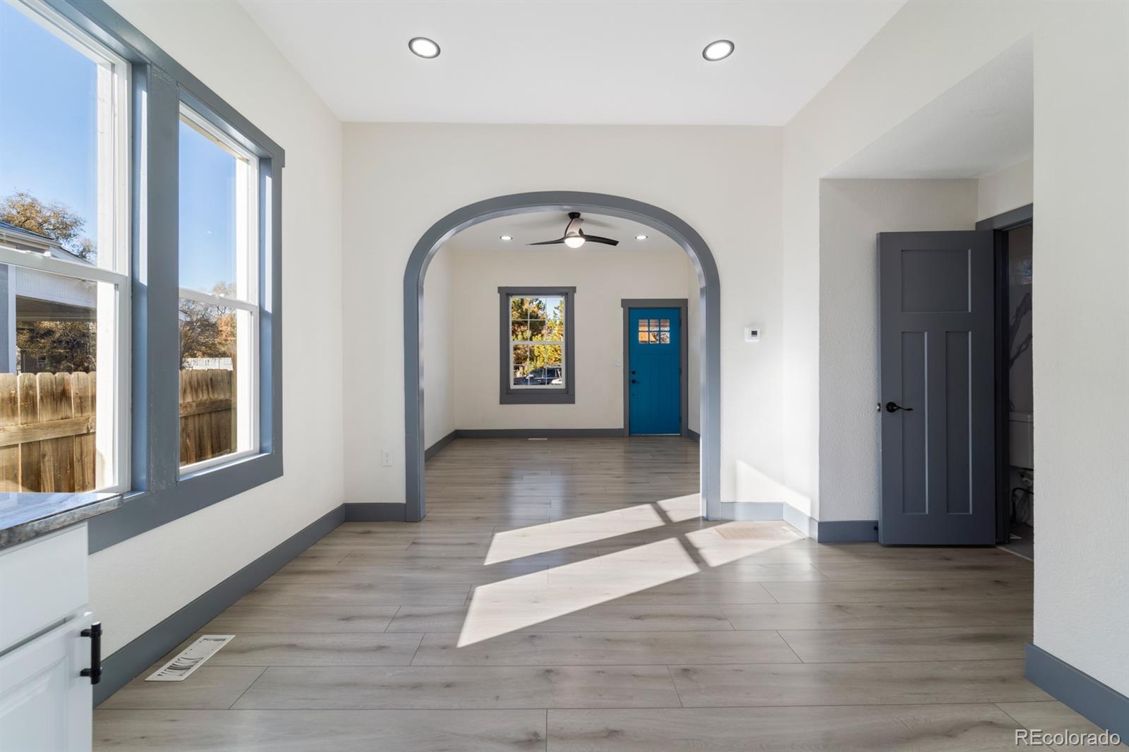 104 Stuart Street Denver, CO 80219 - Photo 12 of 18 a view of an entryway with wooden floor and a window