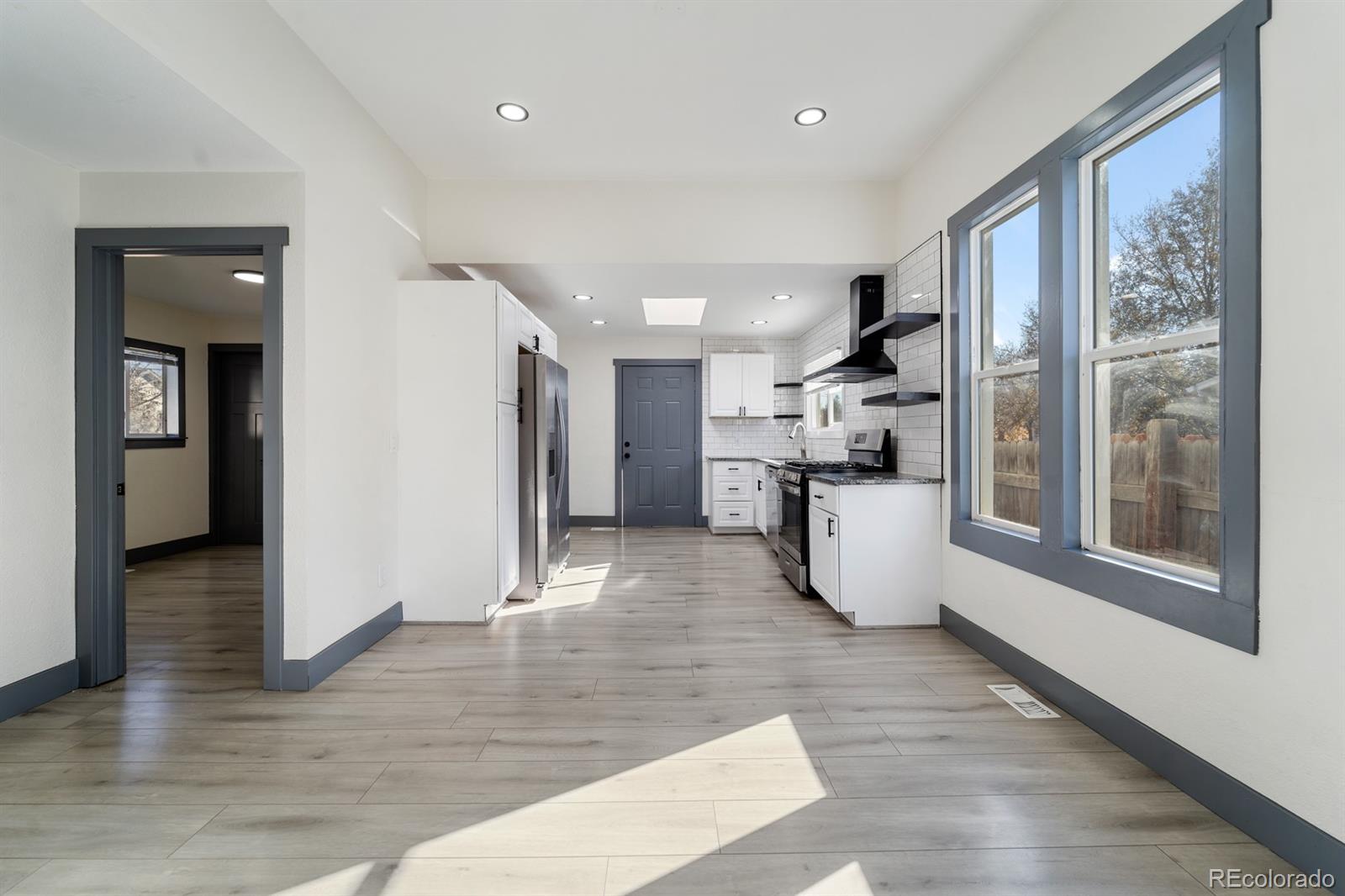 104 Stuart Street Denver, CO 80219 - Photo 5 of 18 a view of kitchen with furniture and wooden floor