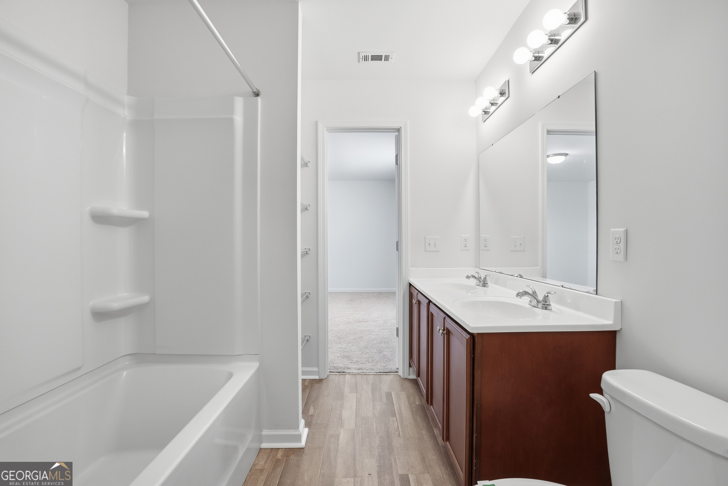 225 Rendell Lane Hinesville, GA 31313 - Photo 25 of 33 a bathroom with a sink toilet tub and shower