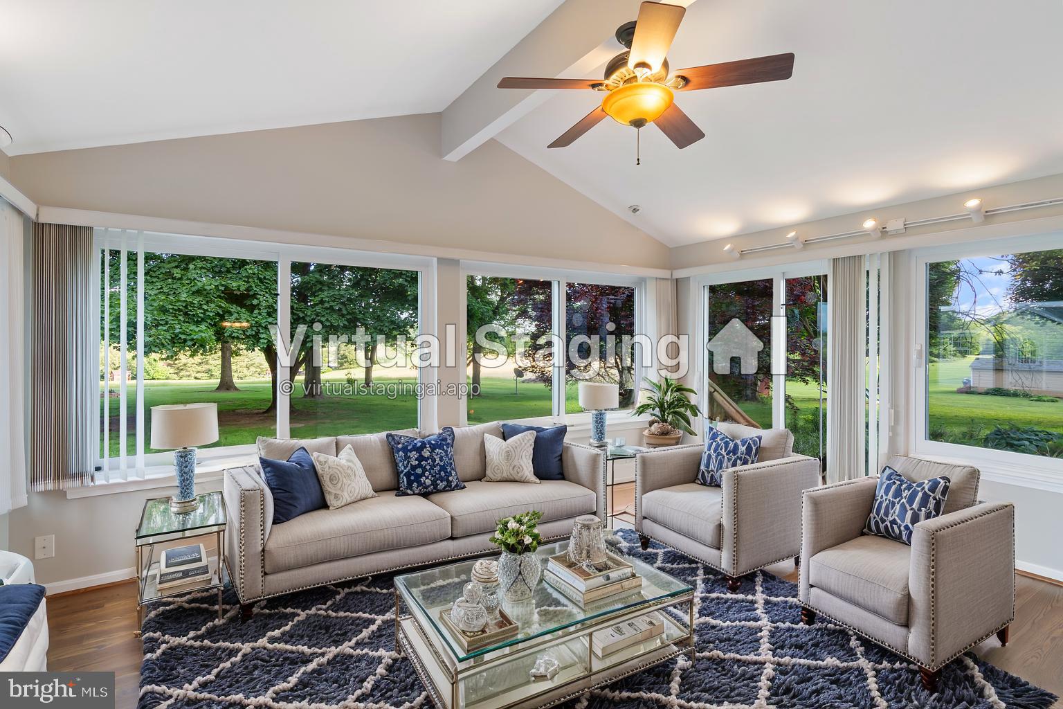 21717 Gunpowder Road Manchester, MD 21102 - Photo 12 of 87 a living room with furniture ceiling fan and a floor to ceiling window
