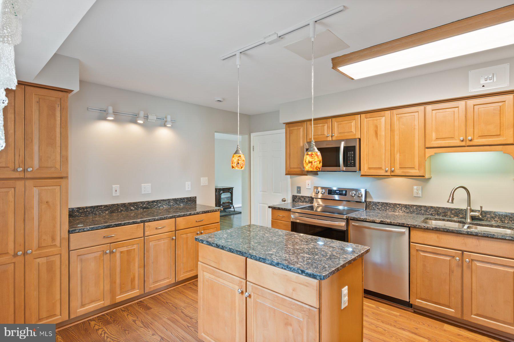 21717 Gunpowder Road Manchester, MD 21102 - Photo 13 of 87 a kitchen with granite countertop cabinets stainless steel appliances a sink and a window