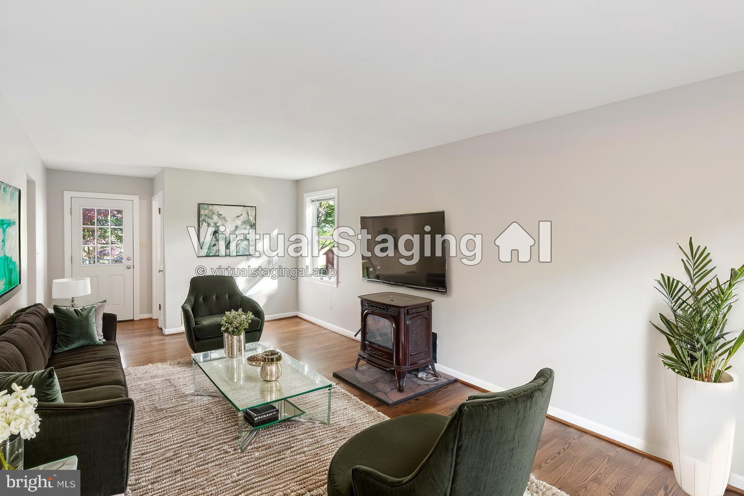 21717 Gunpowder Road Manchester, MD 21102 - Photo 25 of 87 a living room with furniture a wooden floor and a fireplace