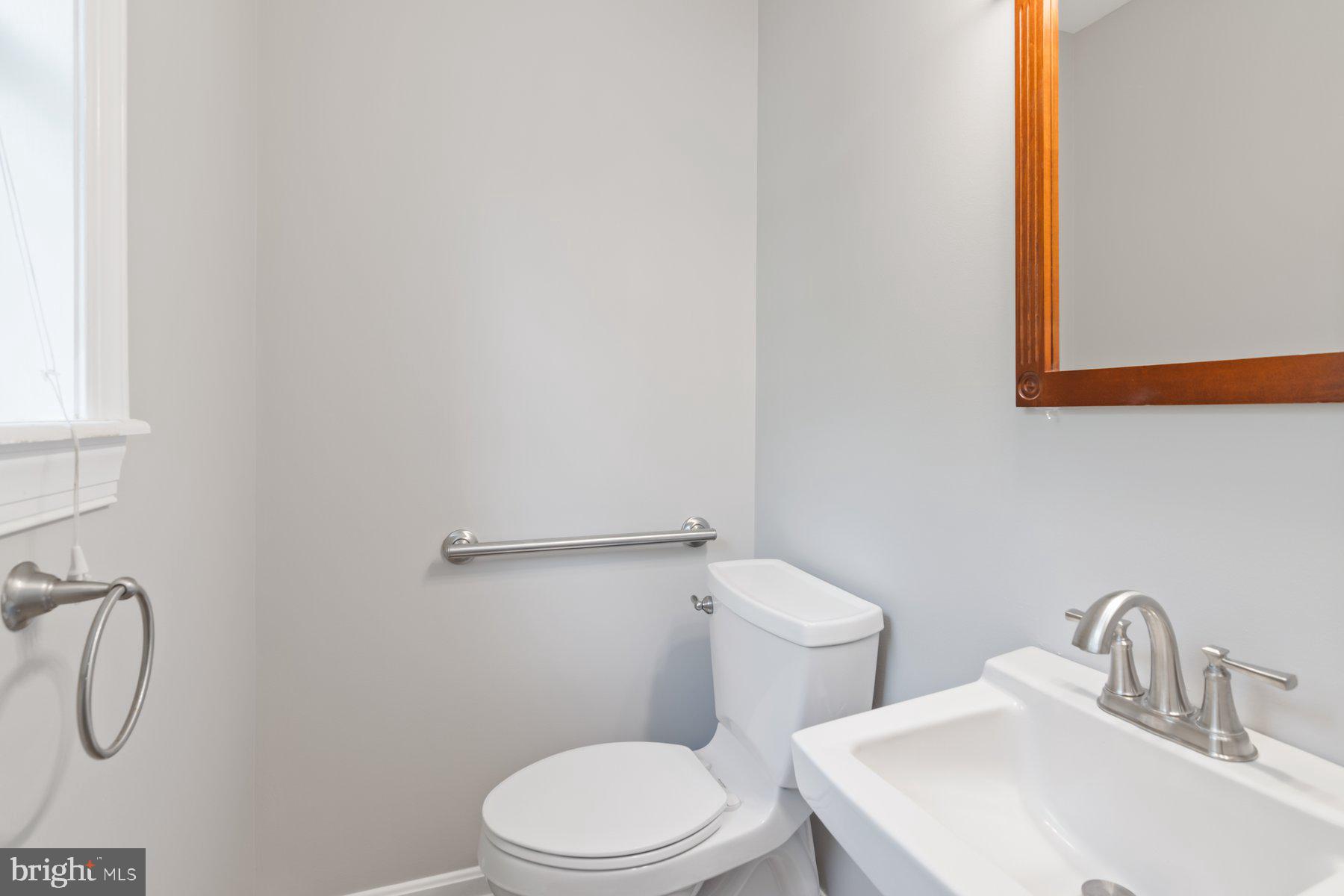 21717 Gunpowder Road Manchester, MD 21102 - Photo 26 of 87 a bathroom with a sink mirror and toilet