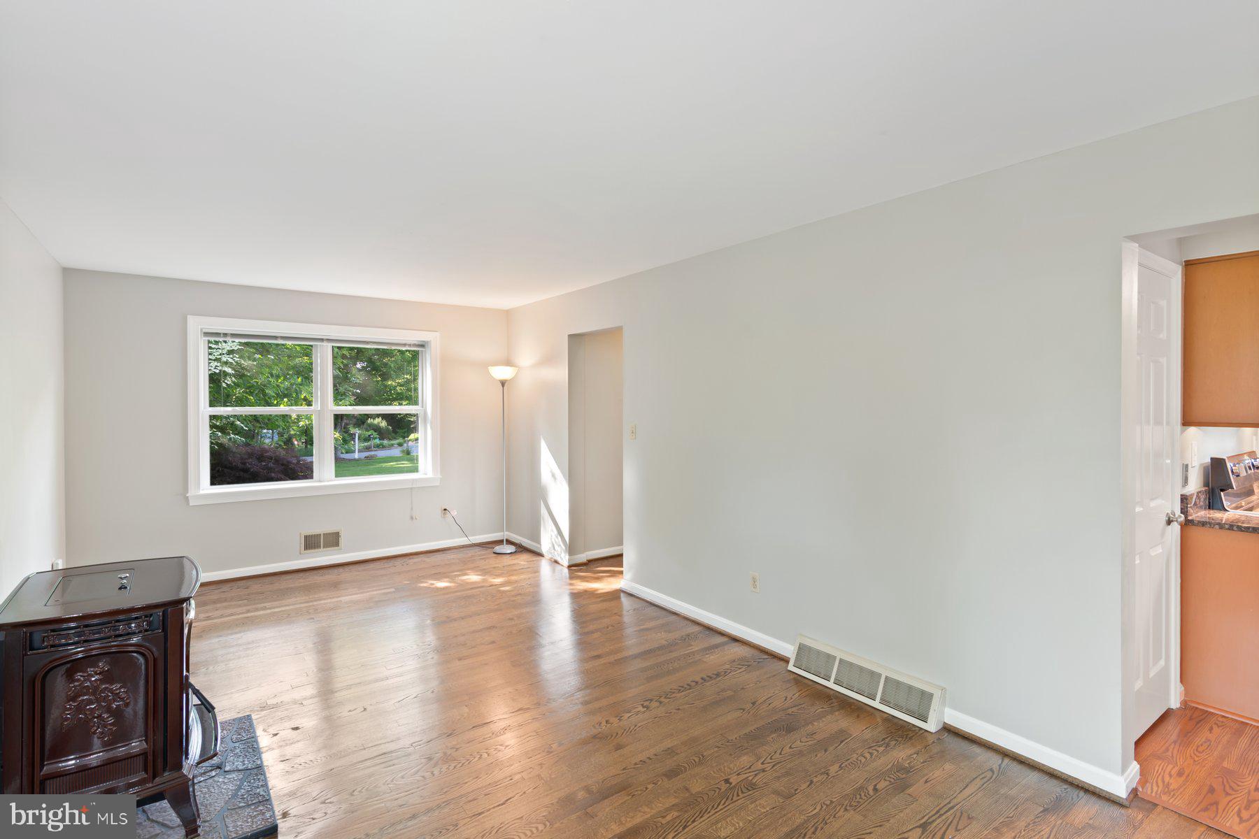 21717 Gunpowder Road Manchester, MD 21102 - Photo 27 of 87 a view of an empty room with wooden floor and a window
