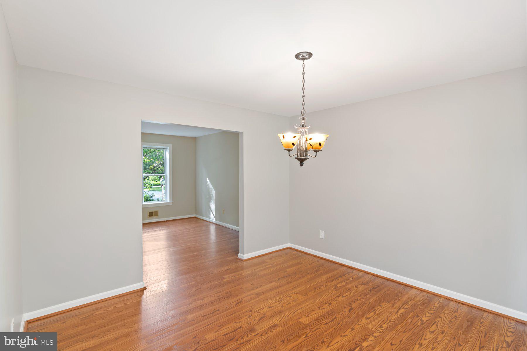 21717 Gunpowder Road Manchester, MD 21102 - Photo 29 of 87 a view of empty room with wooden floor and chandelier