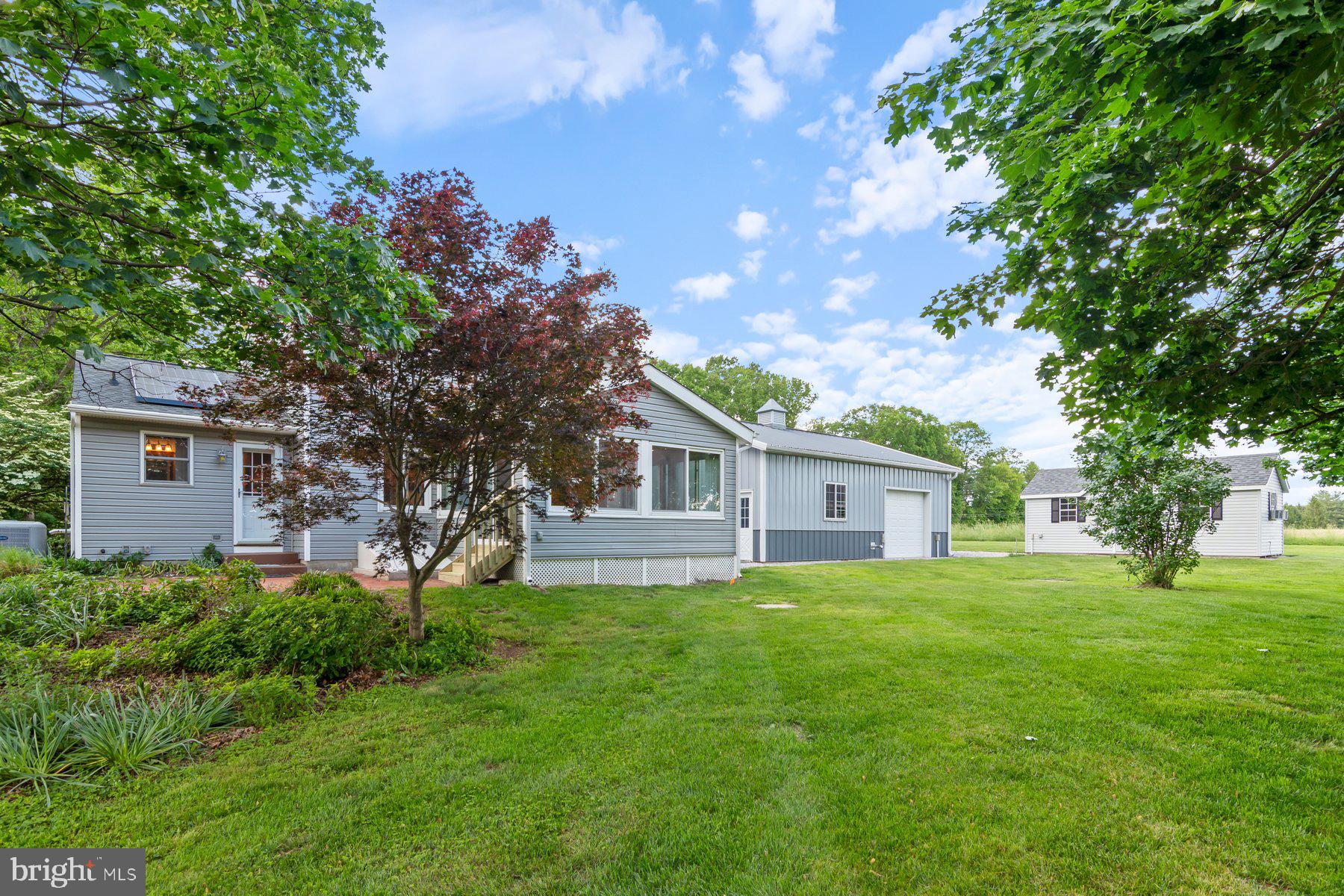 21717 Gunpowder Road Manchester, MD 21102 - Photo 57 of 87 a house view with a sitting space and garden