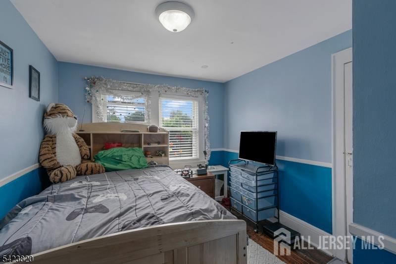 110 Parker Street Middlesex, NJ 08846 - Photo 16 of 25 a bed room with a bed and a television