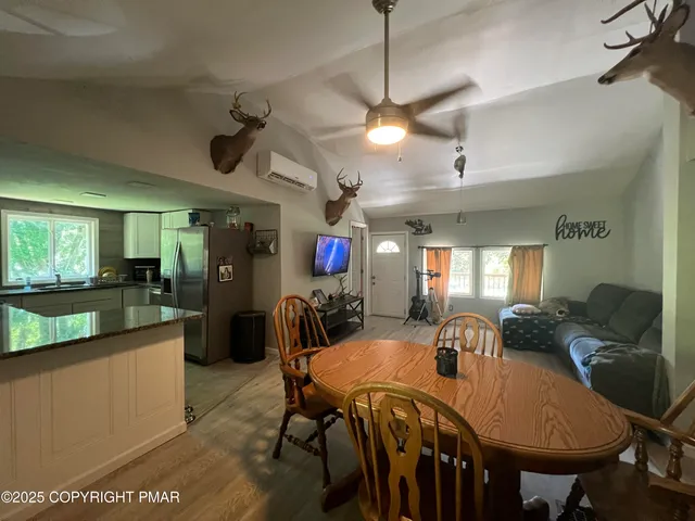 a view of a dining room with furniture