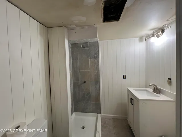 a bathroom with a sink and mirror