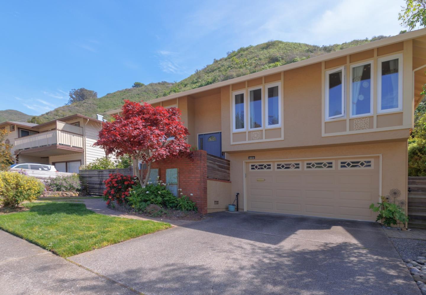 803 Big Bend Drive Pacifica, CA 94044 - Photo 1 of 47 a front view of a house with a yard and garage