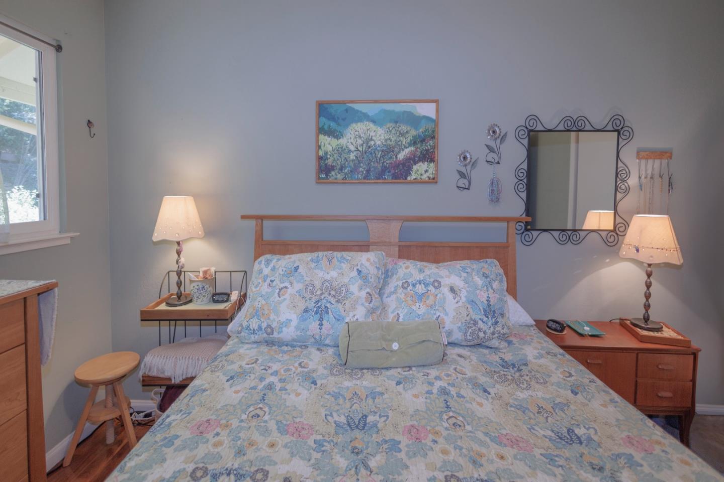 803 Big Bend Drive Pacifica, CA 94044 - Photo 14 of 47 a bedroom with a bed and a lamp on table