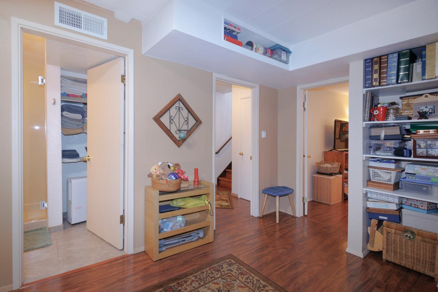 803 Big Bend Drive Pacifica, CA 94044 - Photo 28 of 47 a view of a hallway with wooden floor and furniture