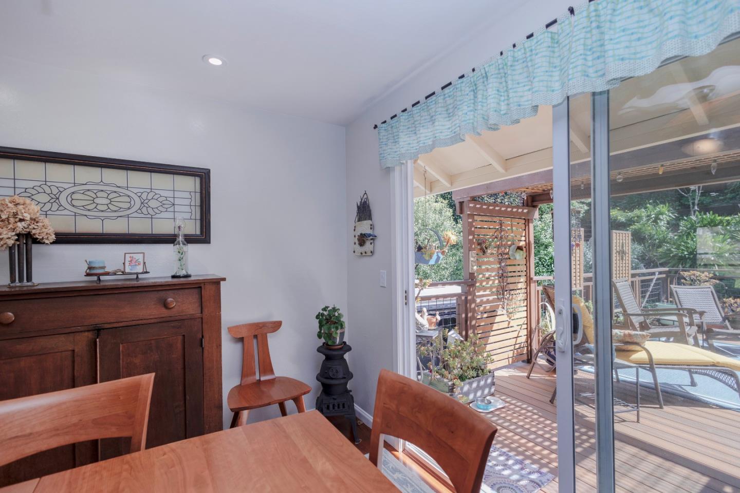803 Big Bend Drive Pacifica, CA 94044 - Photo 32 of 47 a living room with furniture and a floor to ceiling window