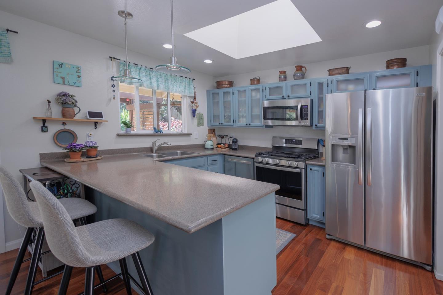 803 Big Bend Drive Pacifica, CA 94044 - Photo 6 of 47 a kitchen with stainless steel appliances granite countertop a sink a stove a refrigerator and a refrigerator