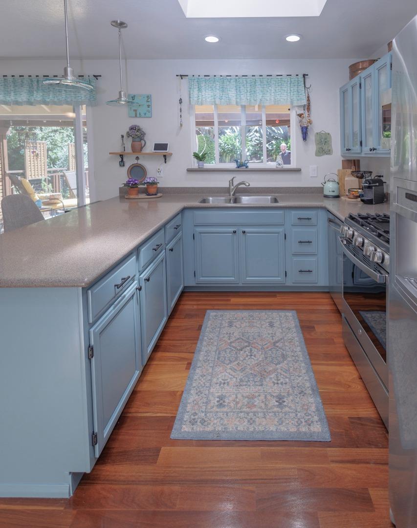 803 Big Bend Drive Pacifica, CA 94044 - Photo 7 of 47 a large kitchen with kitchen island a counter space a stove a sink and cabinets