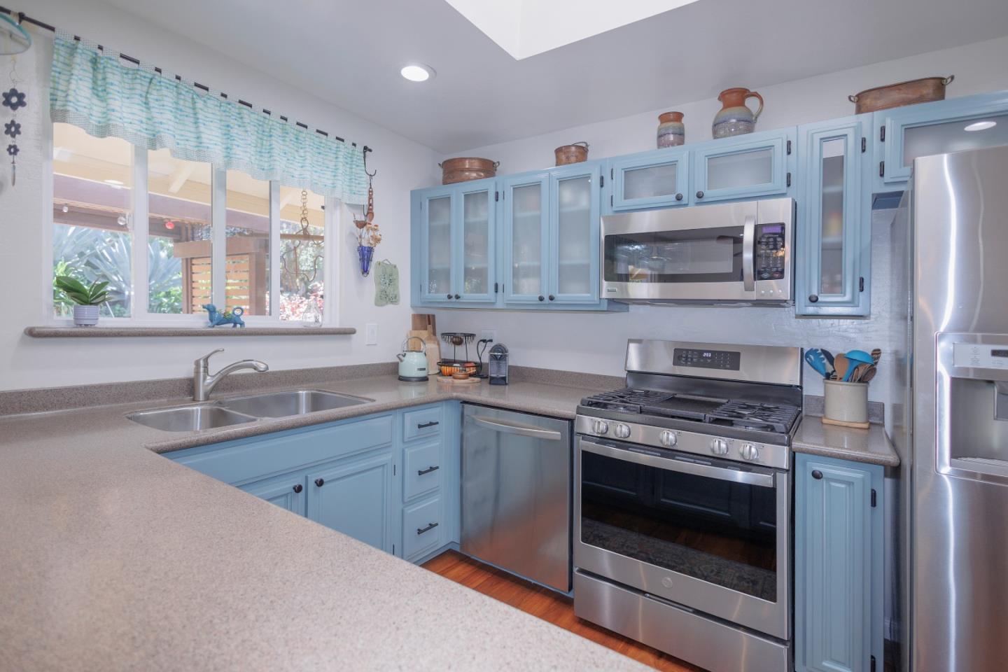803 Big Bend Drive Pacifica, CA 94044 - Photo 9 of 47 a kitchen with stainless steel appliances a stove sink and microwave