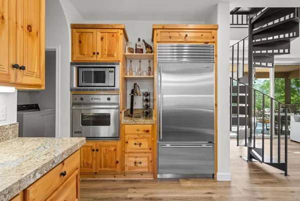 a stove top oven sitting inside of a kitchen