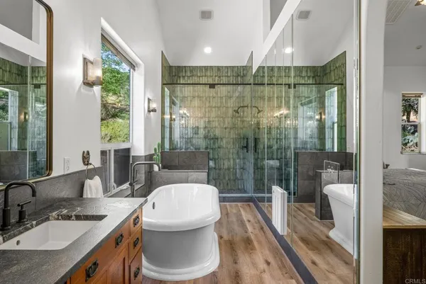 a bedroom with a large bed and a large window