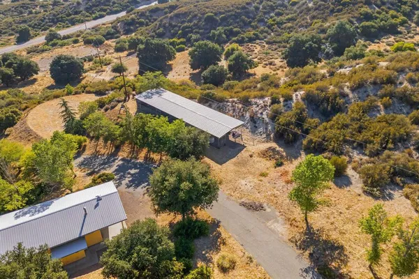 an aerial view of a house with a garden