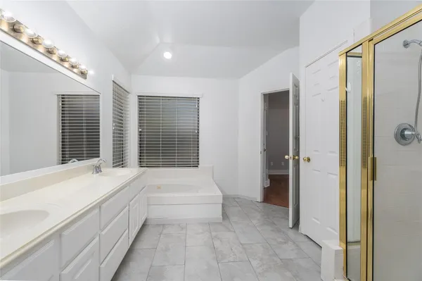 a bathroom with a bathtub and a sink