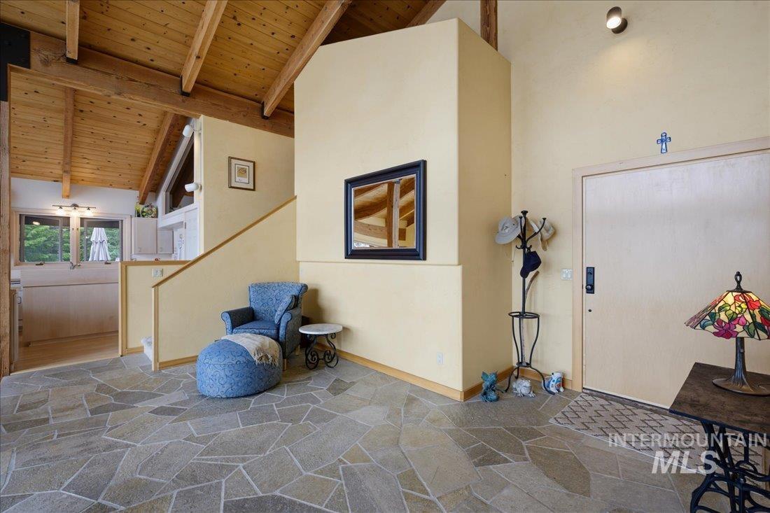 3800 Warren Wagon Road McCall, ID 83638 - Photo 18 of 50 Irregular flagstone flooring complements a vaulted wood-paneled ceiling with exposed beams