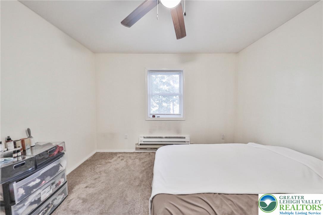 2114 Lakeview Road Bushkill, PA 18324 - Photo 47 of 83 A single window provides natural light in this carpeted bedroom featuring neutral walls.