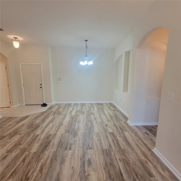 3351 Whitestone Circle, Unit 105 Kissimmee, FL 34741 - Photo 16 of 22 a view of room with wooden floor and window