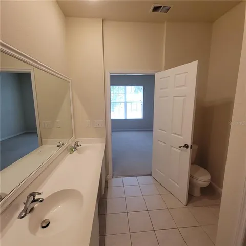 a bathroom with a sink a toilet and tub